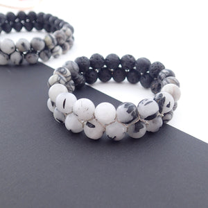 Gemstone bracelet by Pellara, Yin & Yang, made of Lava rock, Map Jasper, Black Silk Stone, Rutilated Quartz & Howlite.