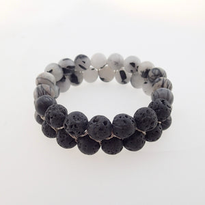 Gemstone bracelet by Pellara, Yin & Yang, made of Lava rock, Map Jasper, Black Silk Stone, Rutilated Quartz & Howlite.
