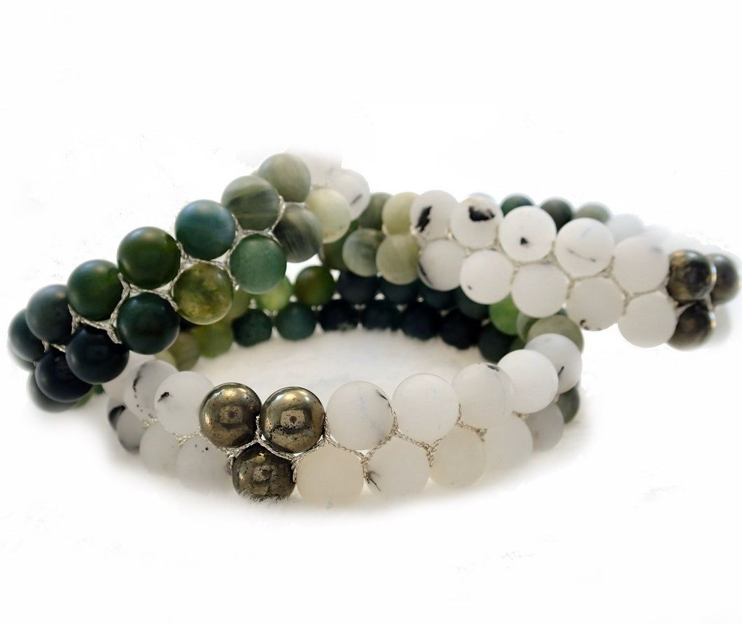 Gemstone bracelet by Pellara, inspired by aurora, made of Green rutilated quartz, White rutilated quartz, moss agate & pyrite . Gemini & Leo zodiacs. 8mm