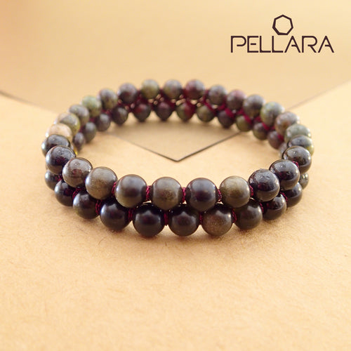 Chakra gemstone bracelet for The Base (Root) Chakra designed by Pellara. Made in Canada. Contains Black Tourmaline, Black Obsidian and Dragon Blood Stone crystals.