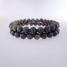 Load image into Gallery viewer, Chakra gemstone bracelet for The Base (Root) Chakra designed by Pellara. Made in Canada. Contains Black Tourmaline, Black Obsidian and Dragon Blood Stone crystals.