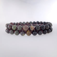Load image into Gallery viewer, Chakra gemstone bracelet for The Base (Root) Chakra designed by Pellara. Made in Canada. Contains Black Tourmaline, Black Obsidian and Dragon Blood Stone crystals.