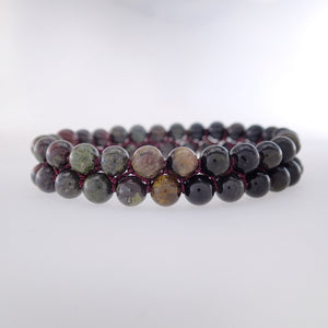 Chakra gemstone bracelet for The Base (Root) Chakra designed by Pellara. Made in Canada. Contains Black Tourmaline, Black Obsidian and Dragon Blood Stone crystals.