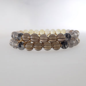 Chakra gemstone bracelet for the Crown Chakra, designed by Pellara. Made in Canada. Contains Citrine, Smoky Quartz and Golden Rutilated Quartz crystals.