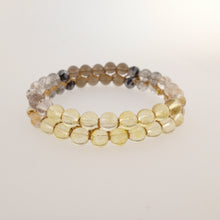 Load image into Gallery viewer, Chakra gemstone bracelet for the Crown Chakra, designed by Pellara. Made in Canada. Contains Citrine, Smoky Quartz and Golden Rutilated Quartz crystals.