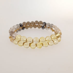 Chakra gemstone bracelet for the Crown Chakra, designed by Pellara. Made in Canada. Contains Citrine, Smoky Quartz and Golden Rutilated Quartz crystals.