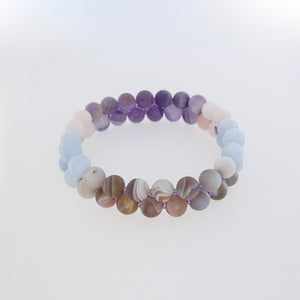 Gemstone bracelet, Essence of Memory by Pellara. Made of Agate, Amethyst and Beryl. The Crown, Throat and base chakras.