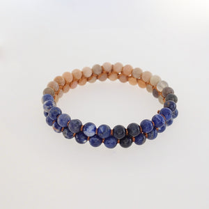 Gemstone bracelet, Twilight by Pellara. Made of Sunstone, Moonstone, Blue Tiger Eye and Sodalite. The Crown, Throat, Sacral and Navel chakras.