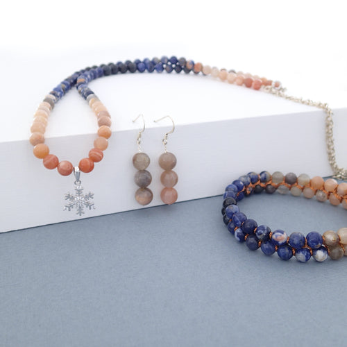 Gemstone jewellery set, Twilight by Pellara. Made of Silver, Sunstone, Moonstone, Blue Tiger Eye and Sodalite, Snowflake pendant