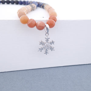 Gemstone jewellery set, Twilight by Pellara. Made of Silver, Sunstone, Moonstone, Blue Tiger Eye and Sodalite, Snowflake pendant